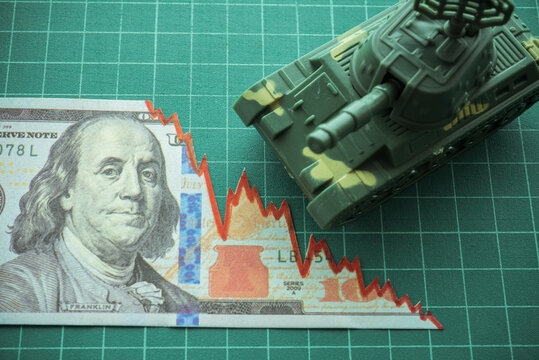 Tear off US dollar banknote as chart graph down with battle tank. World global economy recession crisis due to war Russia vs Ukraine concept. Food and energy shortage. - Powered by Adobe
