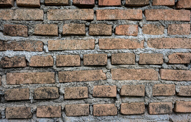 An old brick wall textured and pattern for background usage as a backdrop design.