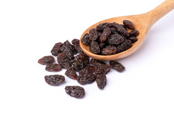 Raisins in wooden spoon isolated on white background.