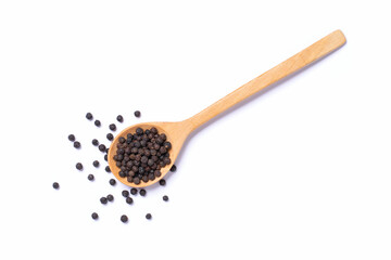 Black peppercorn (black pepper) in wooden spoon isolated on white background, top view, flat lay.