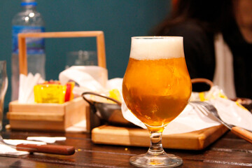 glass of beer at the restaurant table