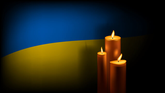 Three burning wax candles with shadow on background of Ukrainian flag. Day of Remembrance of those killed in Ukraine.