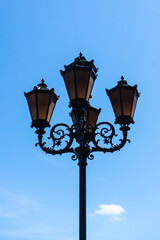 Retro lantern on the background of the blue sky. vintage lantern. A street lantern. 