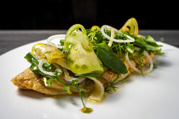 omelet with green salad, tomato, basil, rosemary and onion