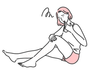 足の肌荒れに悩んでいる若い女性
