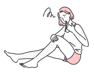 足のムダ毛に悩んでいる若い女性
