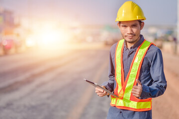 Asian man construction safety suit helmet onsite work, Asian man Engineer