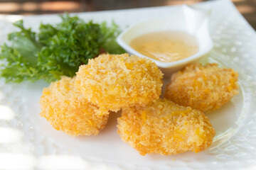 Deep-fried shrimp cakes with dipping sauce. Thai food