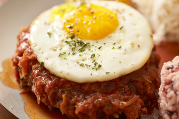 Fried egg on hamburger steak