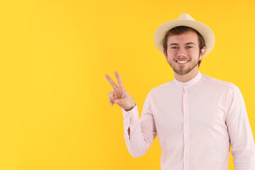 Concept of people, young man on yellow background