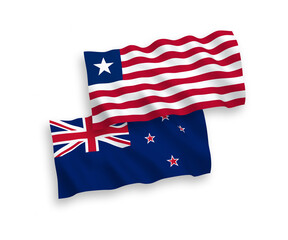 National vector fabric wave flags of New Zealand and Liberia isolated on white background. 1 to 2 proportion.