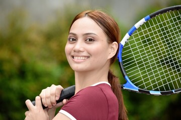 Smiling Beautiful Redhead Female With Tennis Racket Outside