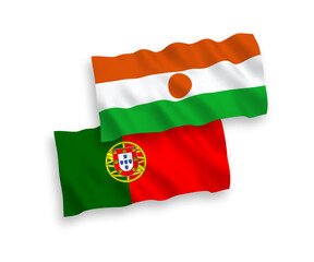 National vector fabric wave flags of Portugal and Republic of the Niger isolated on white background. 1 to 2 proportion.