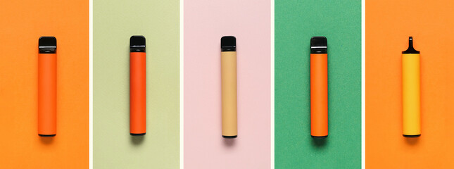 Set of modern electronic cigarettes on color background, top view