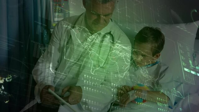 Data processing over caucasian male doctor showing digital tablet to caucasian boy at hospital