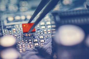 Flag of China on a processor, CPU Central processing Unit or GPU microchip on a motherboard. China is world's largest chip manufacturer, demonstrating the country's superiority in global supply chain.