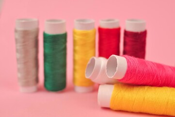 Equipment for sewing on pink background copy space