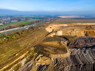 Mining equipment in a brown coal open pit mine near Garzweiler, Germany. Aerial View
