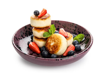 Plate with delicious cottage cheese pancakes, fresh berries and mint leaves on white background
