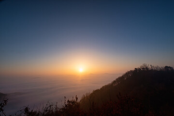 Scenic view of mountains against sky during sunrise