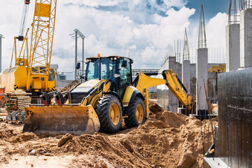 Excavator digs piles. Earthworks for the construction of the foundation. Construction equipment for...