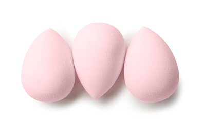 Pink make up sponges on white background, top view