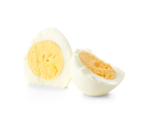 Halves of boiled chicken egg on white background