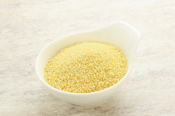 Raw couscous in the bowl