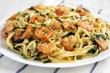 Homemade One-Pot Lemon Garlic Shrimp Pasta on a Plate, side view. Close-up.