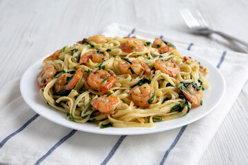 Homemade One-Pot Lemon Garlic Shrimp Pasta on a Plate, side view. Close-up.