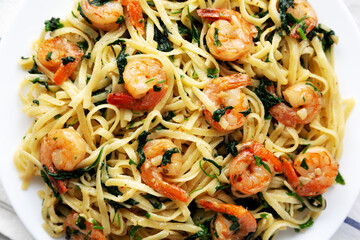Homemade One-Pot Lemon Garlic Shrimp Pasta on a Plate, top view. Flat lay, overhead, from above.