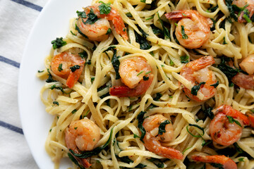 Homemade One-Pot Lemon Garlic Shrimp Pasta on a Plate, top view. Flat lay, overhead, from above. Close-up.