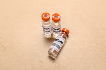 Ampules of monkeypox vaccine on beige background