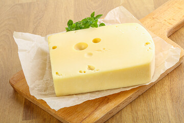 Maasdam cheese over the board