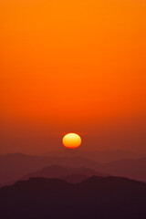 Scenic view of mountains against sky during sunrise
