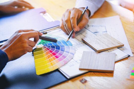 Crop image of Team designer working graphic with color chart and meeting brainstorm for new project. Selected focus.