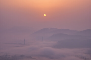 Scenic view of mountains against sky during sunrise