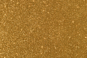 Golden yellow glitter bokeh background. Photo can be used for New Year, Christmas and all celebration concepts.
