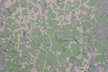 Peeling paint on the wall. Old concrete wall with cracked flaking paint. Weathered rough painted...