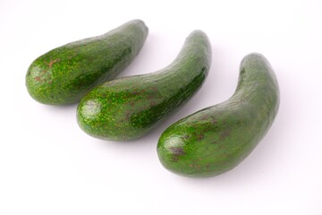 green avocado fruit isolated on white background