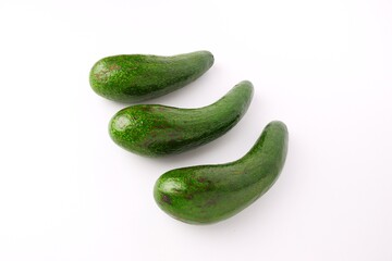green avocado fruit isolated on white background