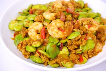 Stir-Fried Pork with Stink Beans and Shrimp Paste,Thai food isolated on white background 