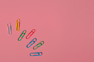 paper clips on a colored background with space for text