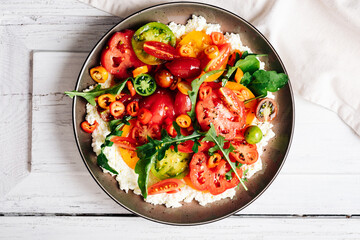 Tomato salad with cheese.