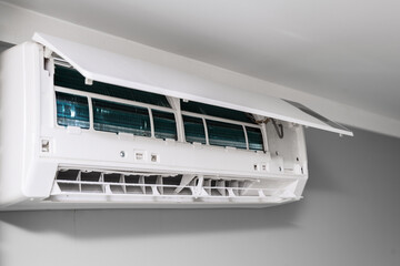 home air conditioner with open lid for repair and cleaning