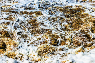 the turbulent background of the water surface during floods up close