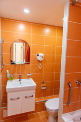 Bathroom in orange colors