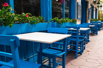 Street cafe in blue tones, empty tables in Istanbul