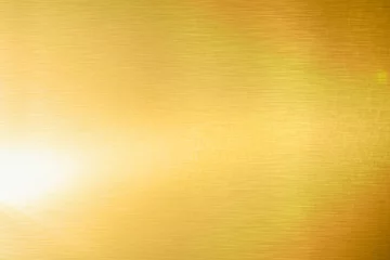 Fotobehang Gold texture background with yellow metallic foil luxury shiny shine glitter sparkle of bright light reflection. Metal bronze golden surface, celebration, banner, wallpaper © merrymuuu