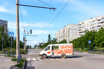 civilian car destroyed by Russian troops under the rubble. Residential area Saltovka. War in Ukraine.